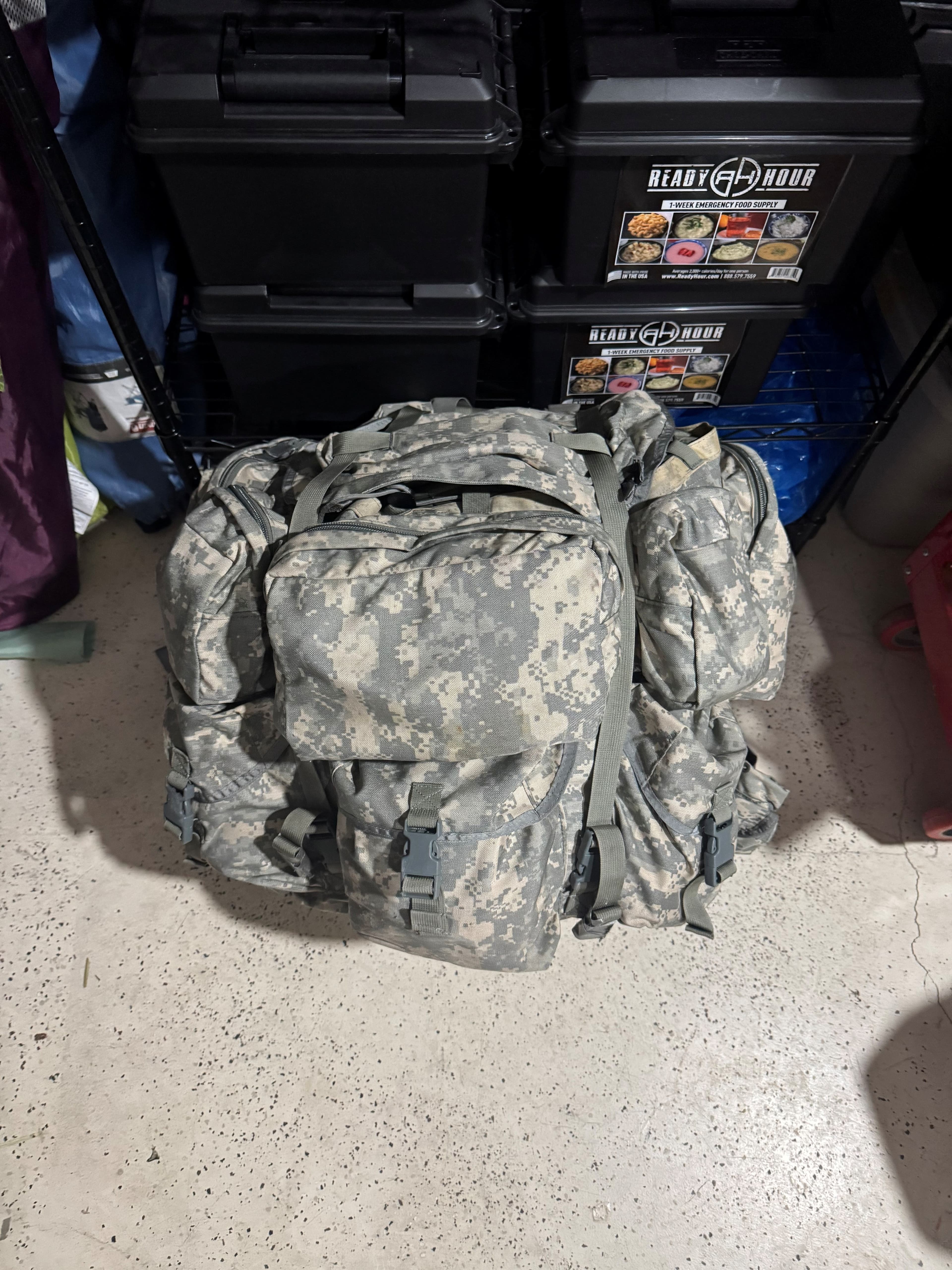 A rucksack packed with emergency preparedness gear and supplies